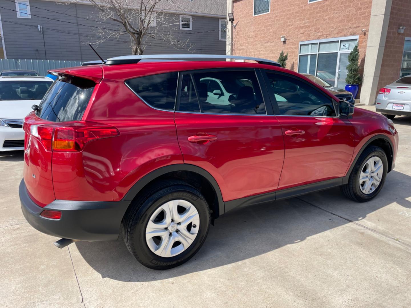 2013 Red /Silver Toyota RAV4 LE (2T3ZFREV0DW) with an 2.5L engine, Automatic transmission, located at 1501 West 15th St., Houston, 77008, (713) 869-2925, 29.797941, -95.411789 - Photo#2